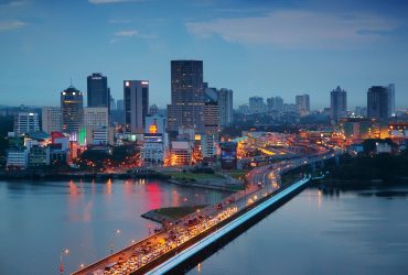 The Malaysian city of Johor Bahru, with heavy traffic on the Johor-Singapore Causeway at dusk.